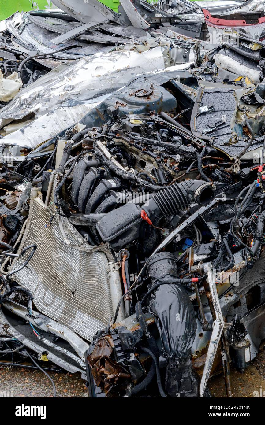 The front of a very badly wrecked car. Car completely smashed, engine