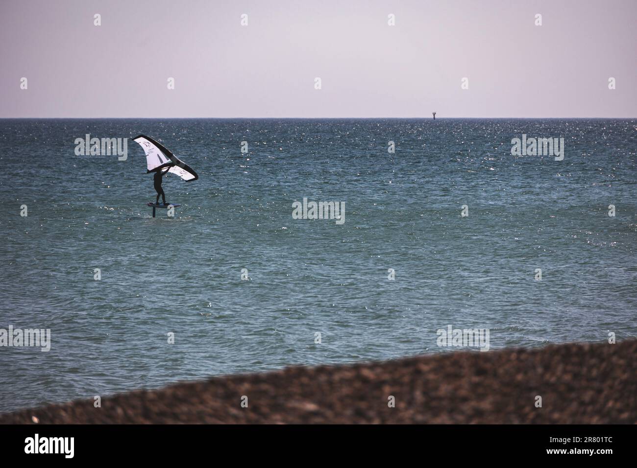 Wing surfer off the coast at Worthing, West Sussex, UK Stock Photo