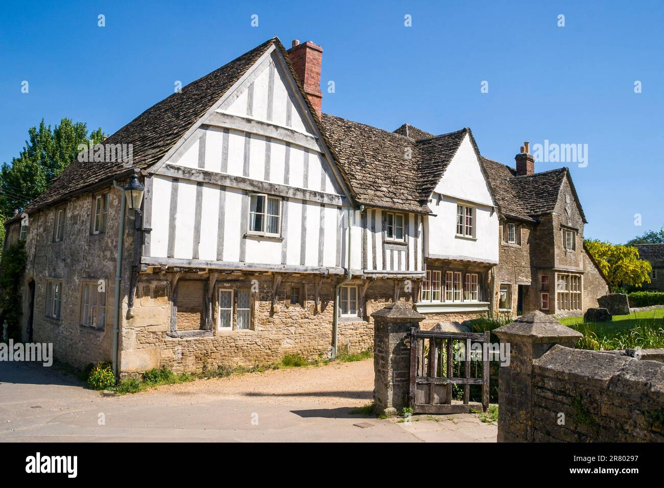 Church street in Lacock, in England. Large half timbered plaster house