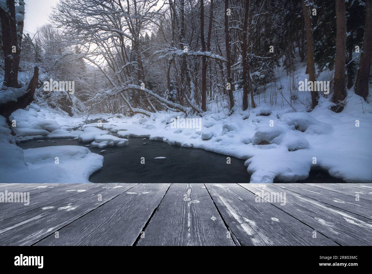 River flowing In winter time with empty wooden batten bridge. Natural ...