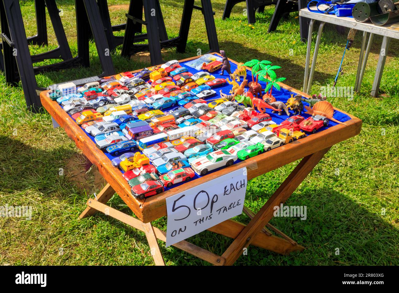 A table of children's miniature toy vehicles for sale at Abbey Hill Steam Rally, Yeovil, Somerset, UK Stock Photo