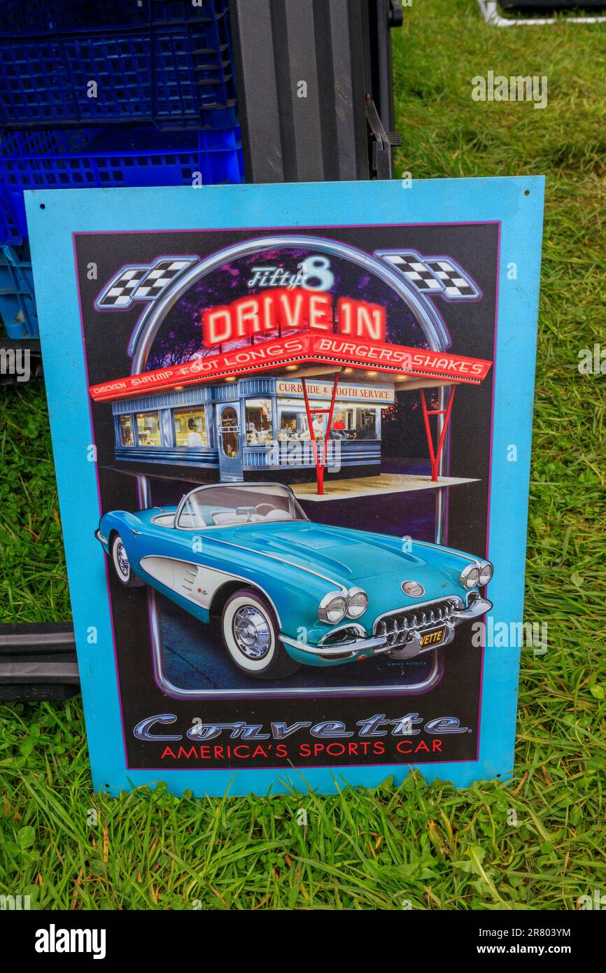 A replica drive-in sign with a Chevrolet Corvette at Abbey Hill Steam Rally, Yeovil, Somerset, UK Stock Photo