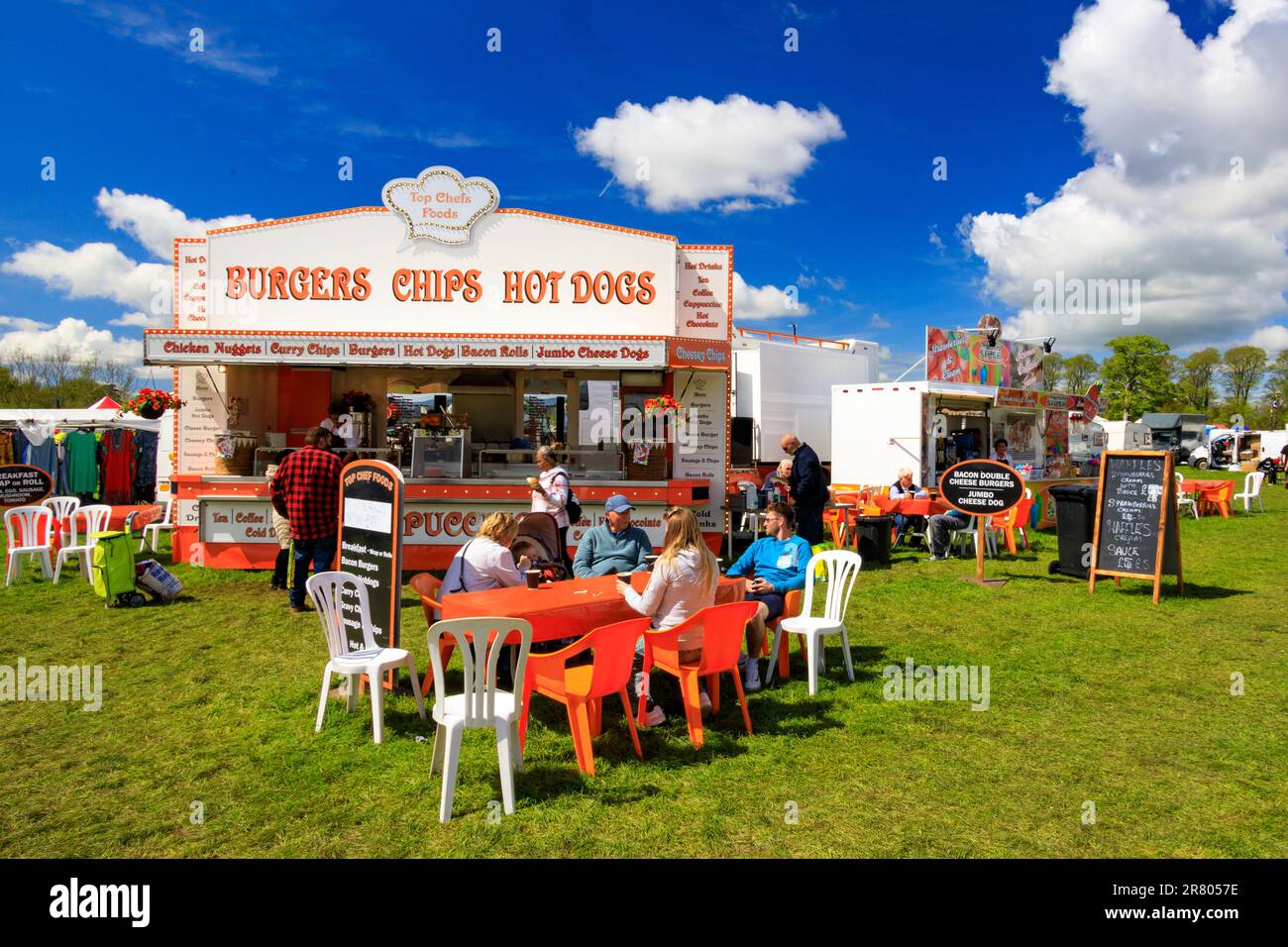 A colourful fast food stall - burgers, chips, hot dogs etc at the Abbey Hill Steam Rally, Yeovil, Somerset, England, UK Stock Photo