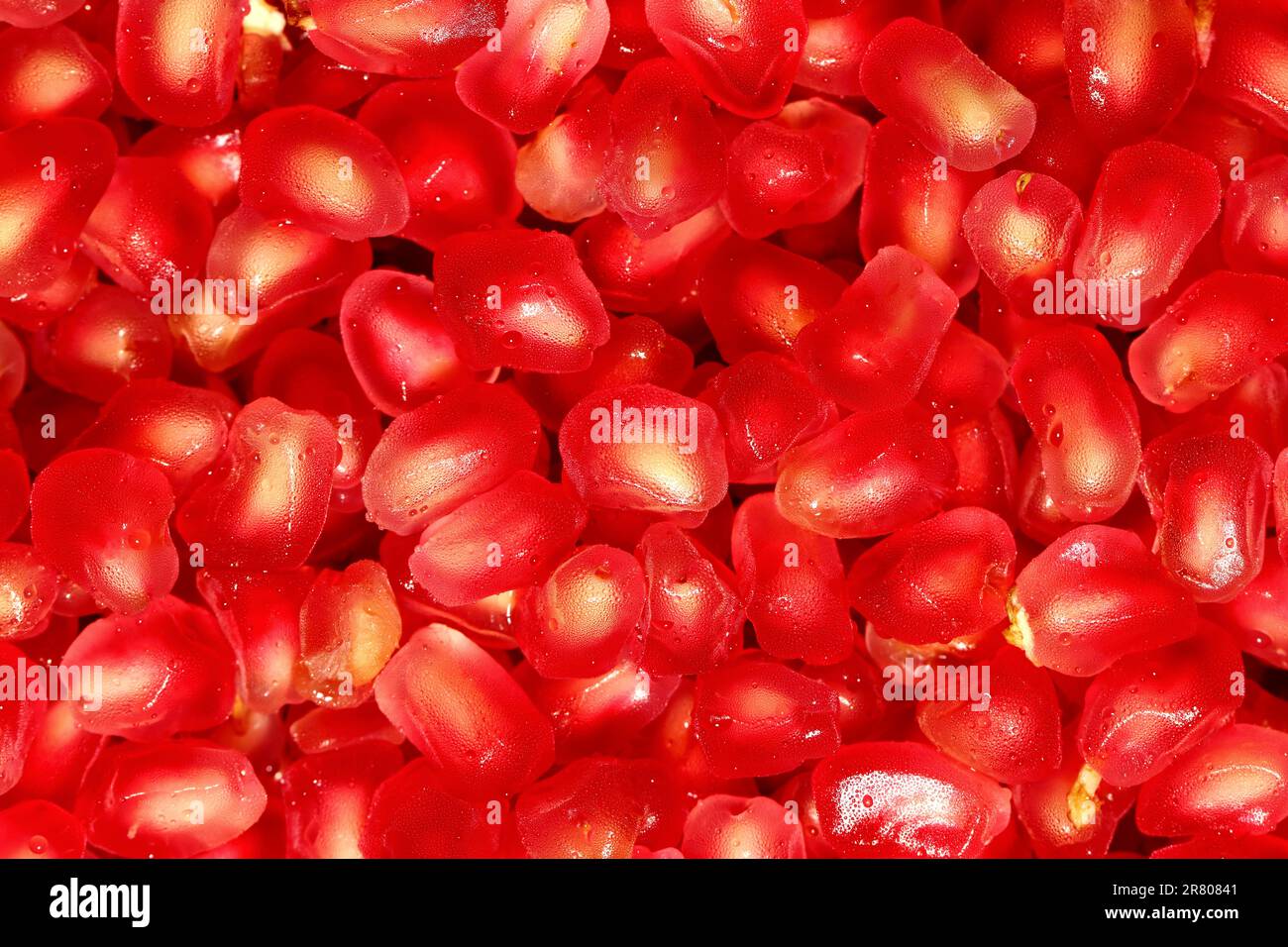Closeup fresh pomegranate seeds background Stock Photo