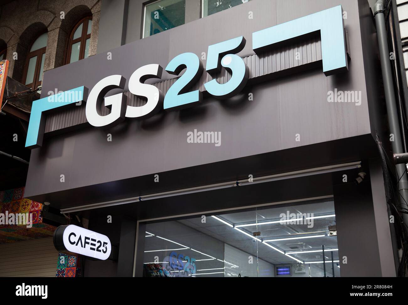 Ho Chi Minh City, Vietnam - June 4, 2023: Blue and black commercial sign with GS25 logo on a convenience store. Advertisement outside a grocery store - Stock Image