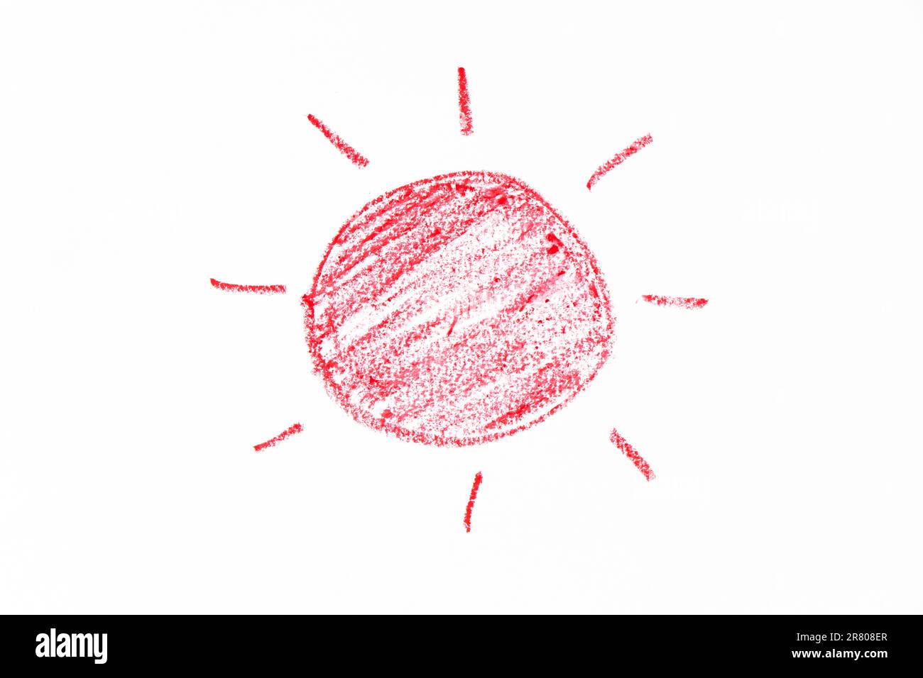 Red color oil pastel hand drawing in sun with ray shape on white paper