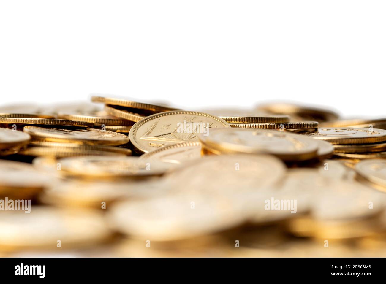 Stacks of gold coins of Pakistani currency symbolize wealth and