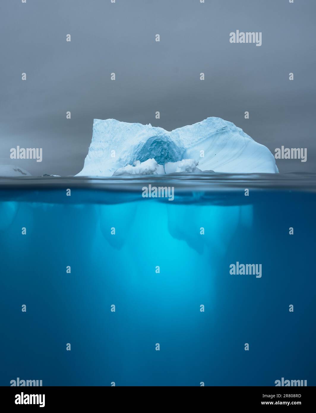 Split view of an iceberg showing above and below the water line