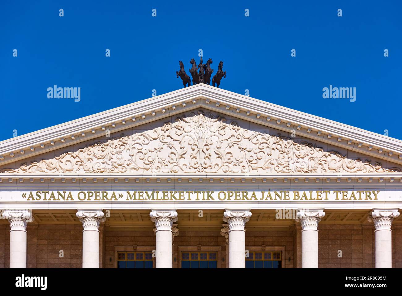 Astana (Nur-Sultan), Kazakhstan - April 3, 2023:  Neoclassical pediment of Astana Opera - New Opera and Ballet Theatre close-up Stock Photo