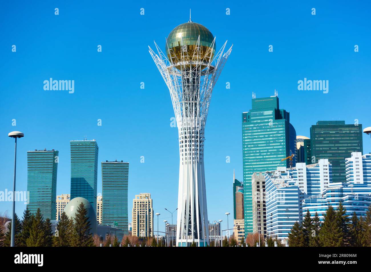Astana (Nur-Sultan), Kazakhstan - April 4, 2023: Buildings of Astana city and Baiterek tower Stock Photo