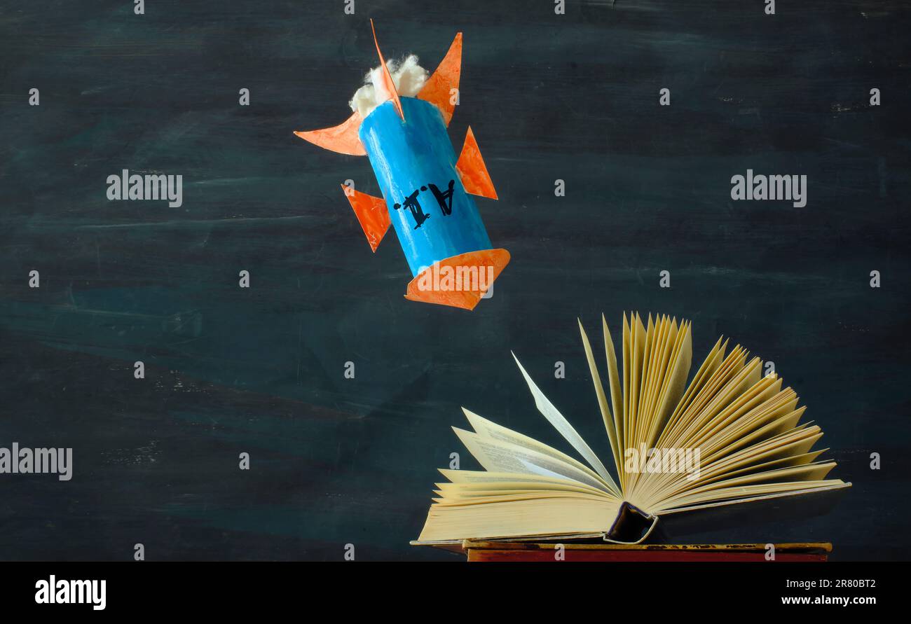 danger of artificial intelligence for education,knowledge and learning concept with open book and impacting rocket with caption A.I. Stock Photo