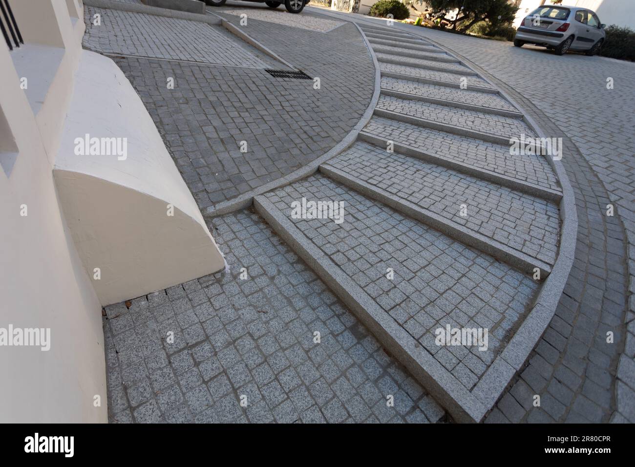 Semi-circular paving stone staircase seen from an upper perspective. Stock Photo