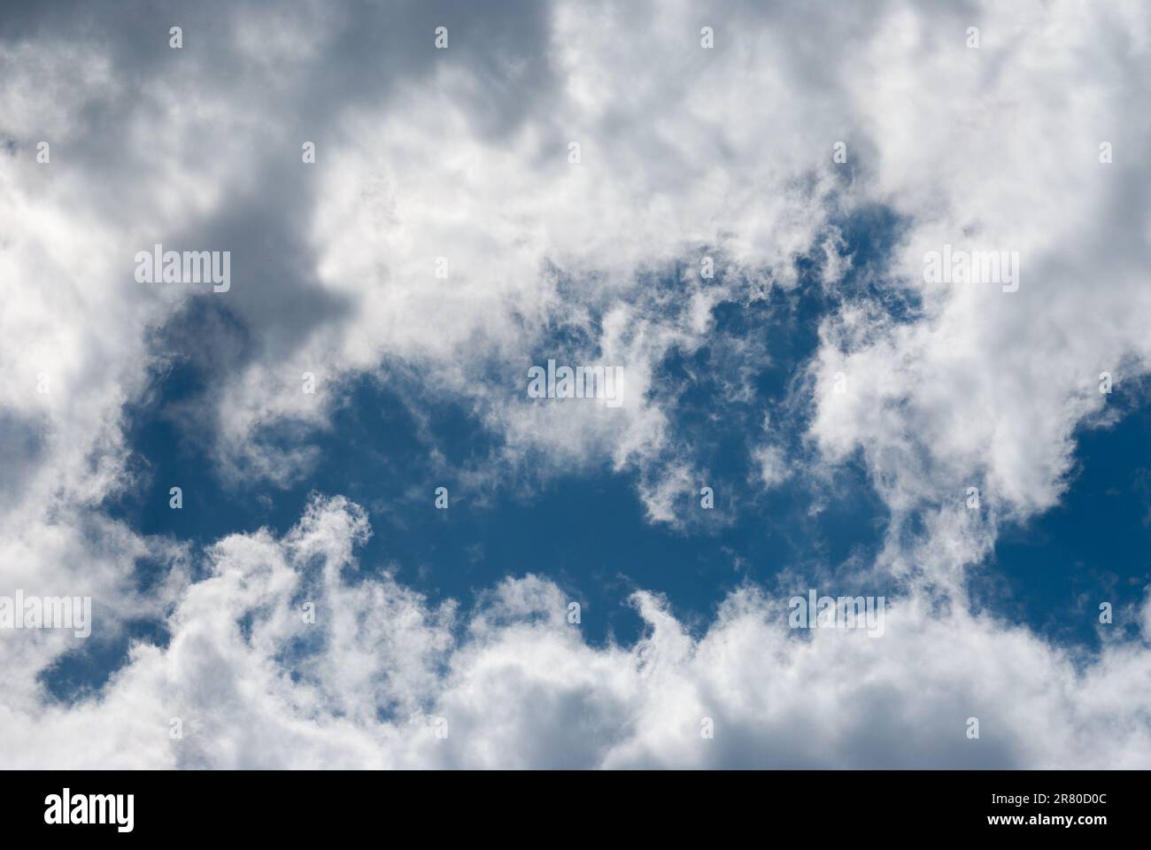 Blue sky background with clouds. Natural background Stock Photo - Alamy