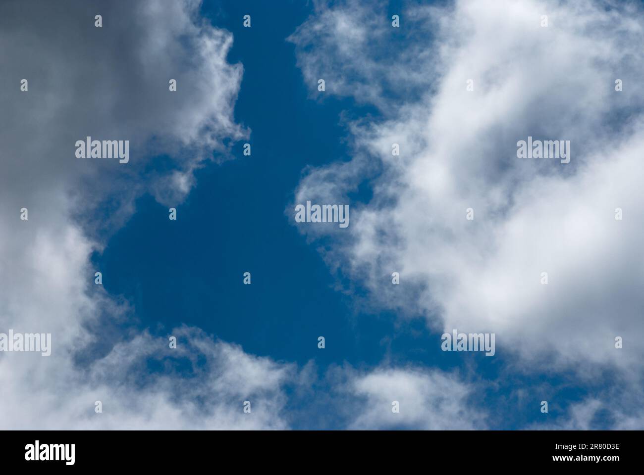 Blue sky background with clouds. Natural background Stock Photo - Alamy