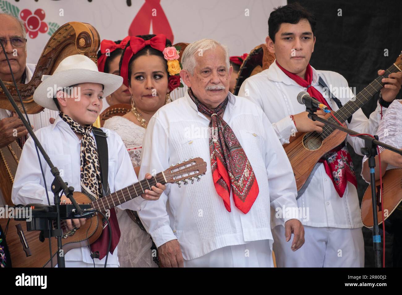 A closeup of a group of musicians dressed in traditional clothes