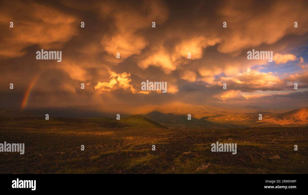 The Sky With Clouds And A Rainbow After The Rain Stock Photo - Alamy