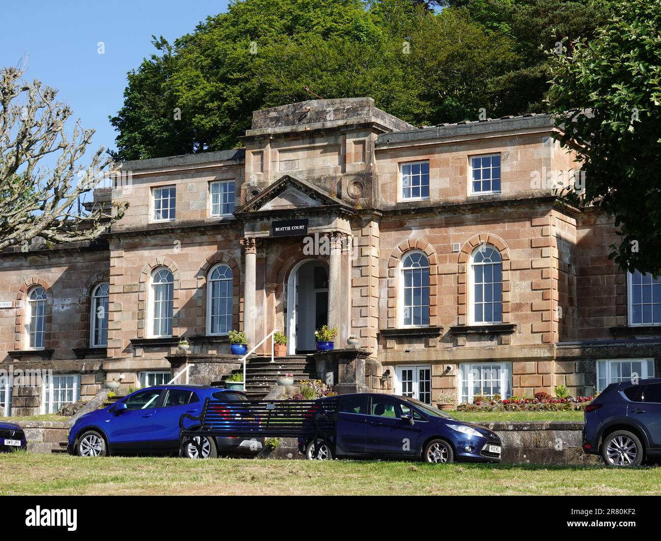 Originally built as the Royal Aquarium in 1875, Beattie Court is now divided into housing flats overlooking Rothesay Bay, Isle of Bute, Scotland, UK. Stock Photo