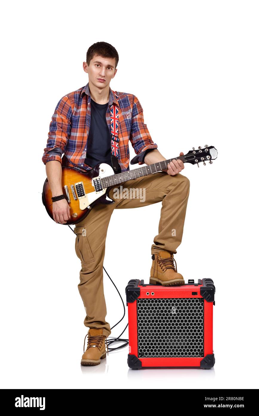 rocker man playing an electric guitar with combo amp Stock Photo Alamy