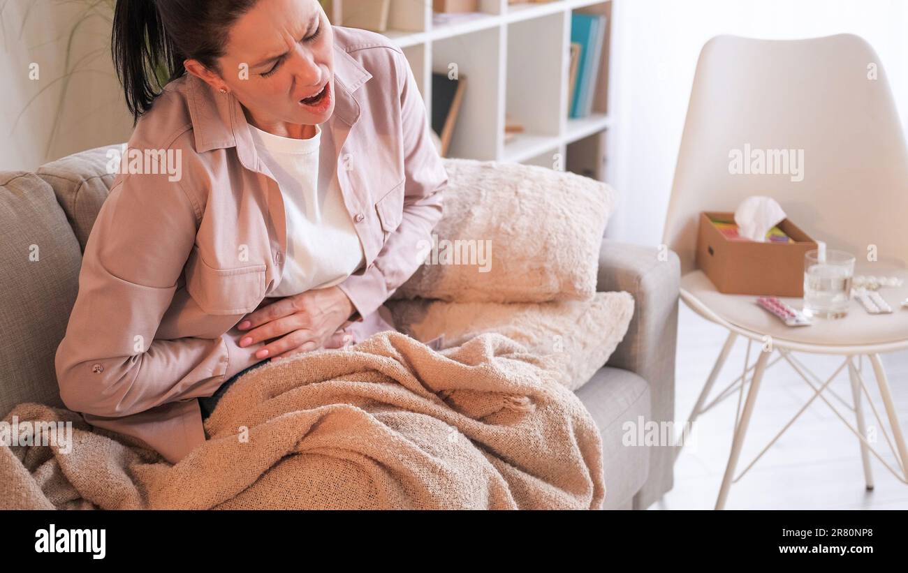 Belly ache tummy pain suffering woman stomach Stock Photo Alamy