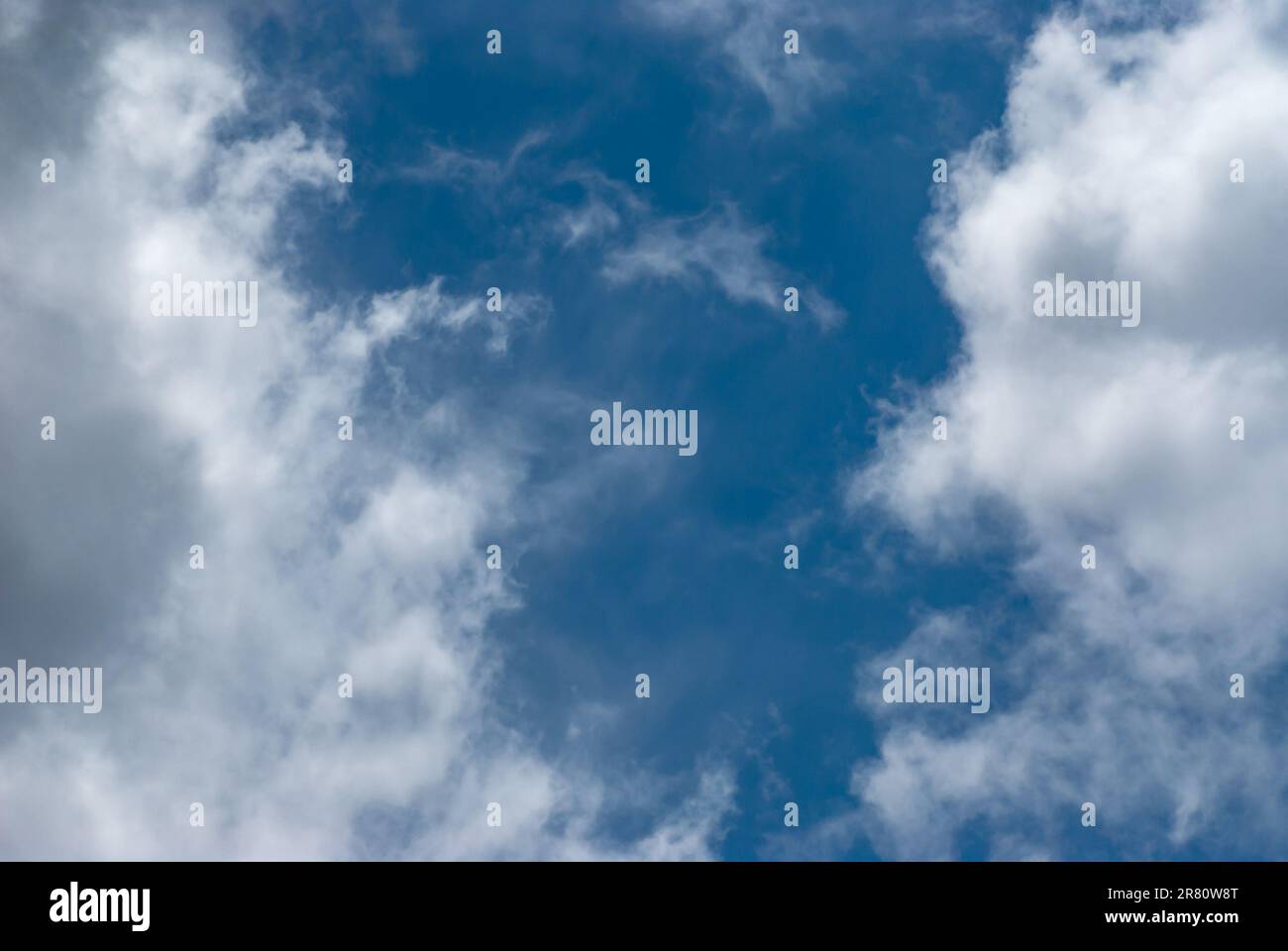 Blue sky background with clouds. Natural background Stock Photo - Alamy
