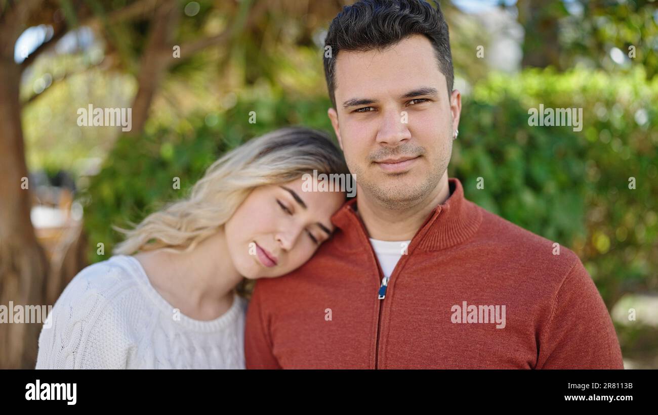 Man and woman couple smiling confident standing together at park Stock ...