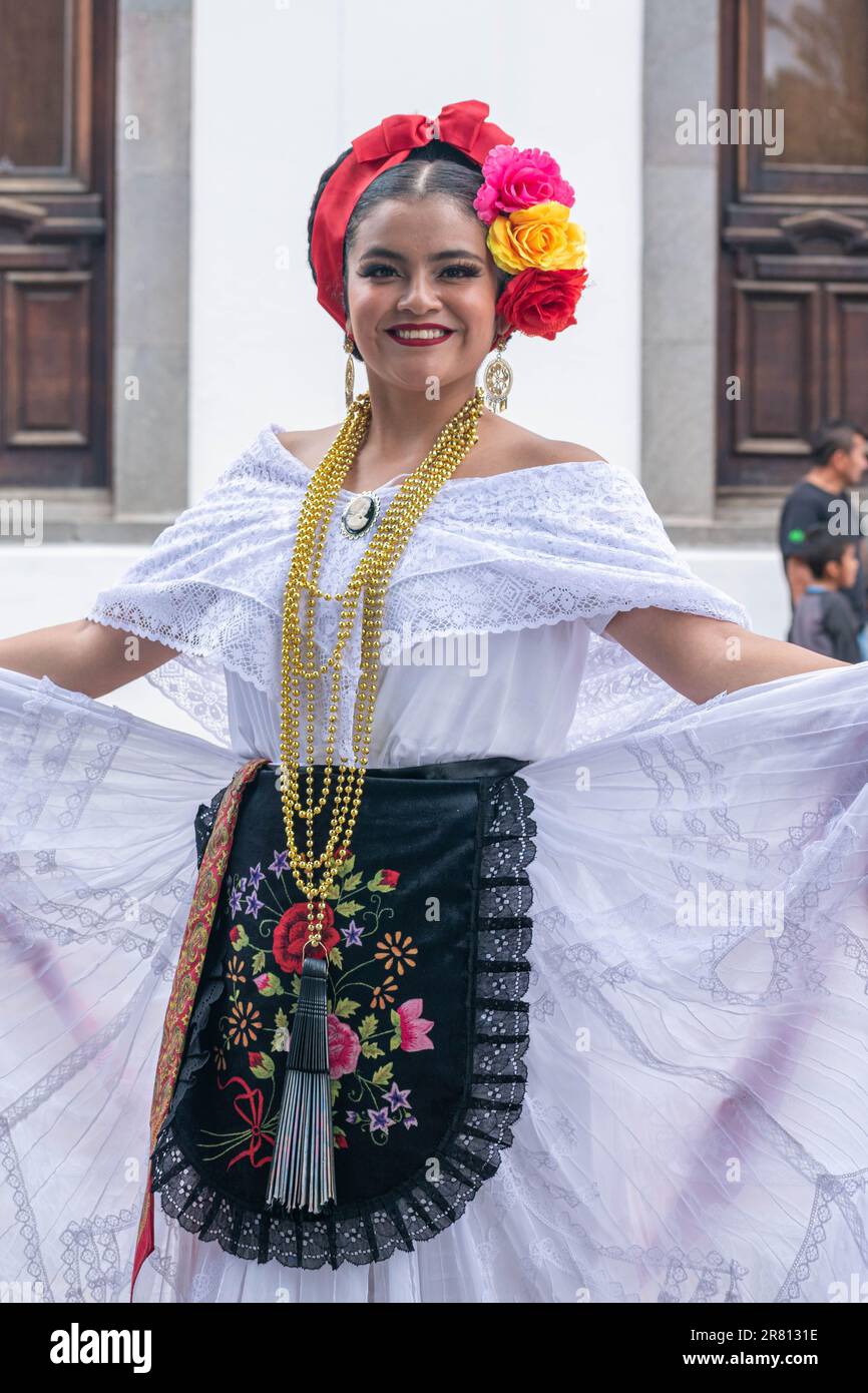 A young beautiful woman dressed in traditional clothes during a