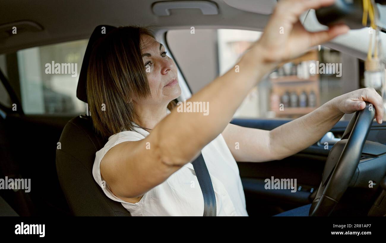 Woman adjusting car seat hi-res stock photography and images - Alamy