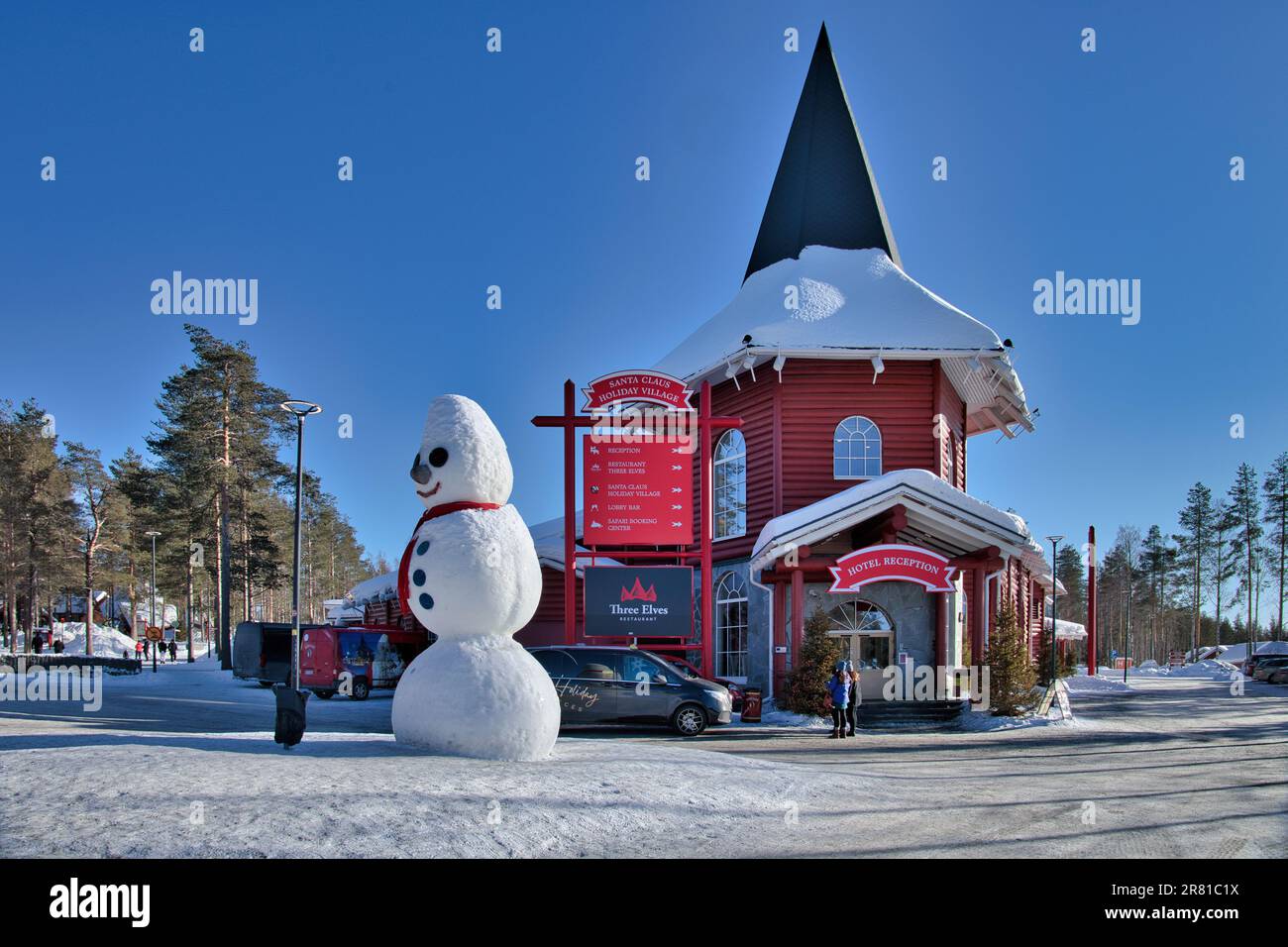 Santa Claus Village, Arctic Circle, Rovaniemi, Lapland, Finland, winter  with snow - tourists and giant snowman outside hotel Stock Photo - Alamy