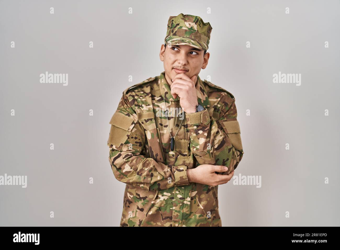 Young arab man wearing camouflage army uniform thinking worried about a ...