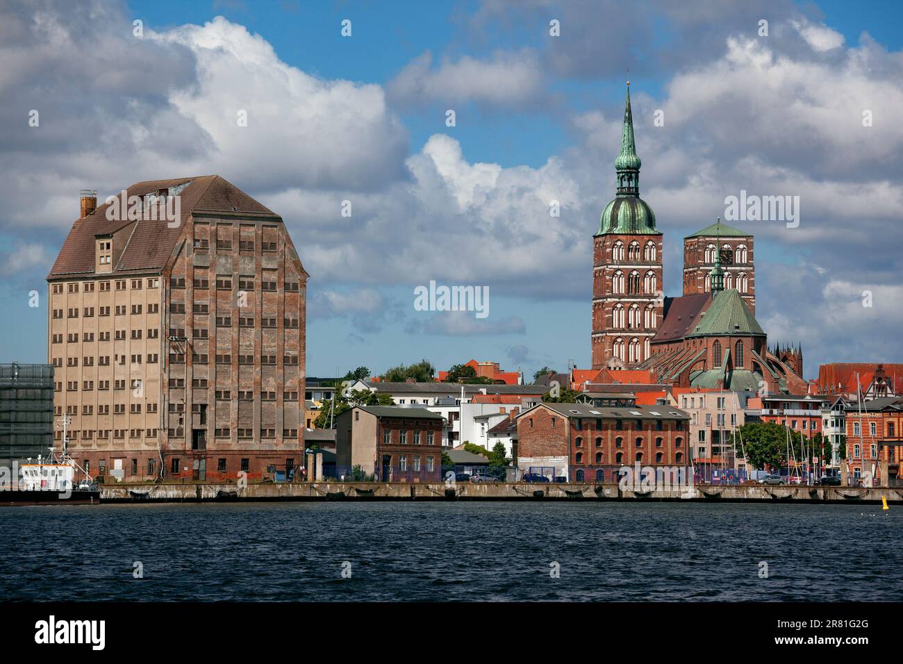 Stralsund panorama - The two Gothic bell towers of the St. Nicholas Church, port and old brick gothic granary Stock Photo