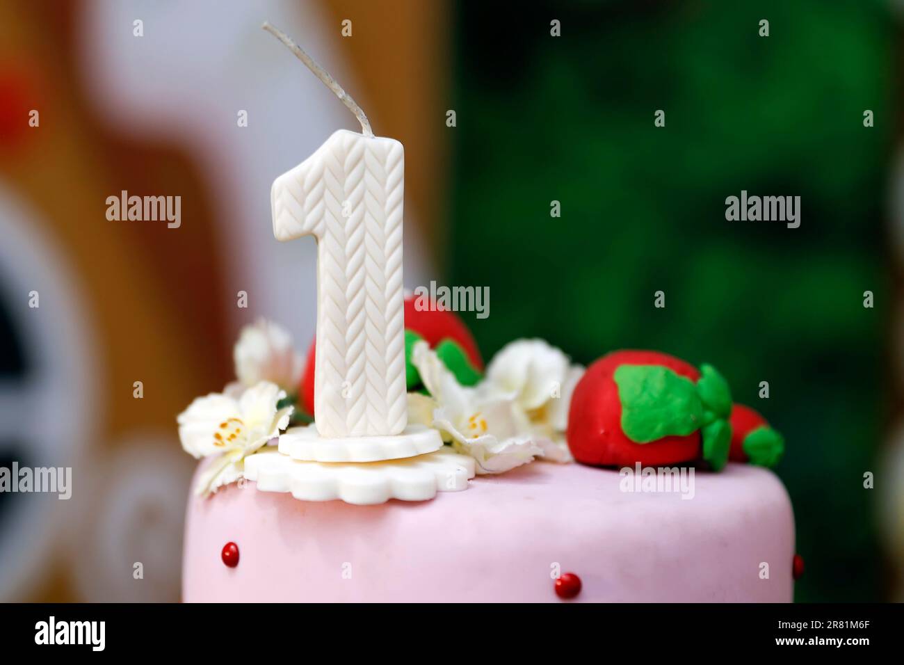 detail of the number one on the top of the birthday cake, 1st birthday, white cake, 1 year old birthday cake Stock Photo