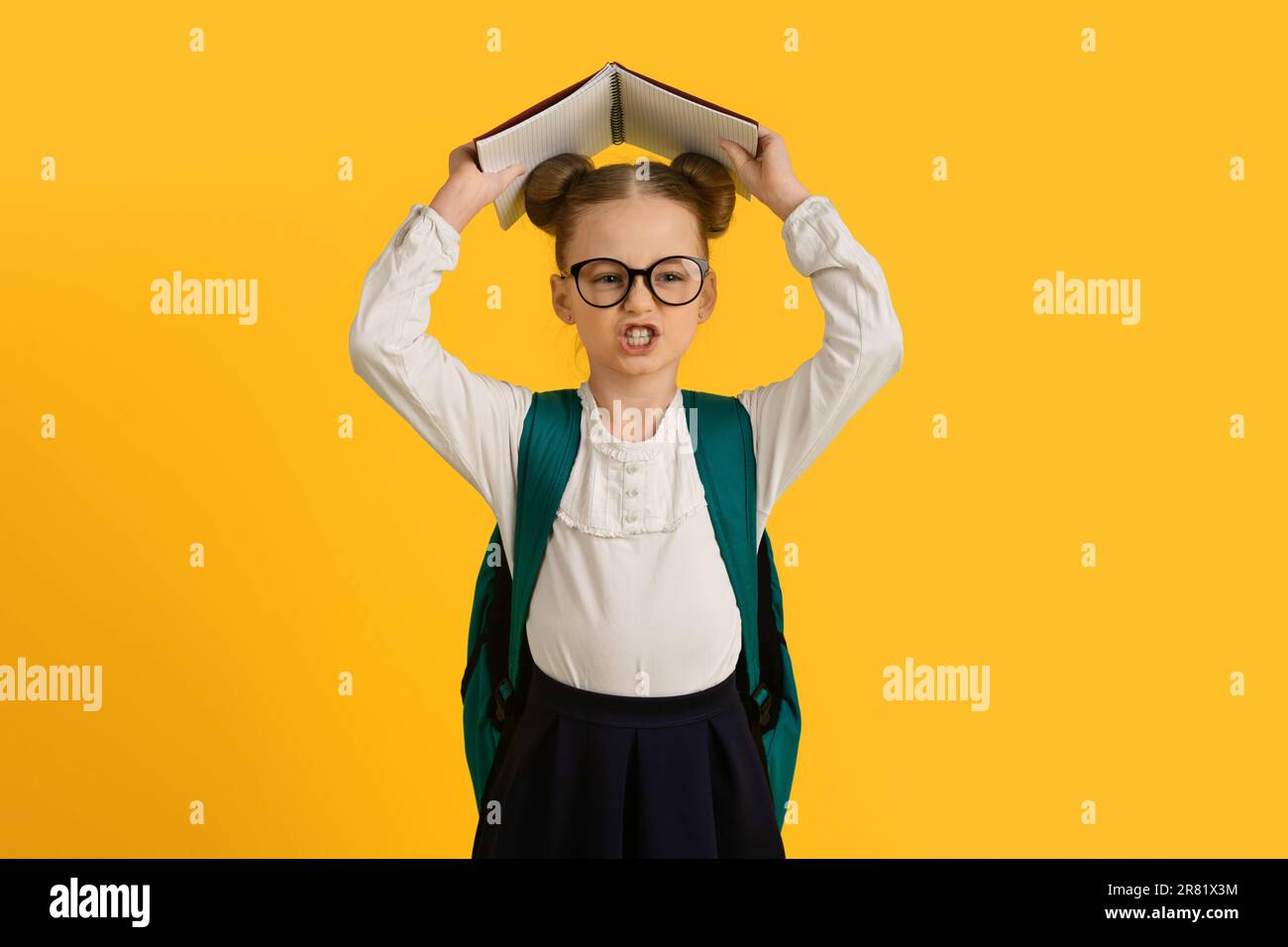 Learning Difficulties. Angry Little Schoolgirl Covering Head With Book ...