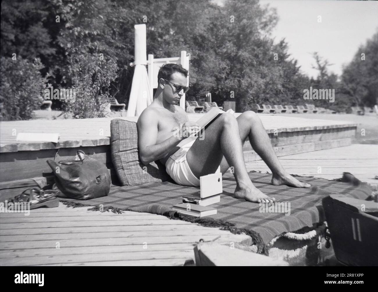 College Student 1949 1950 studying reading by a lake Syracuse University New York NY vintage B&W Stock Photo