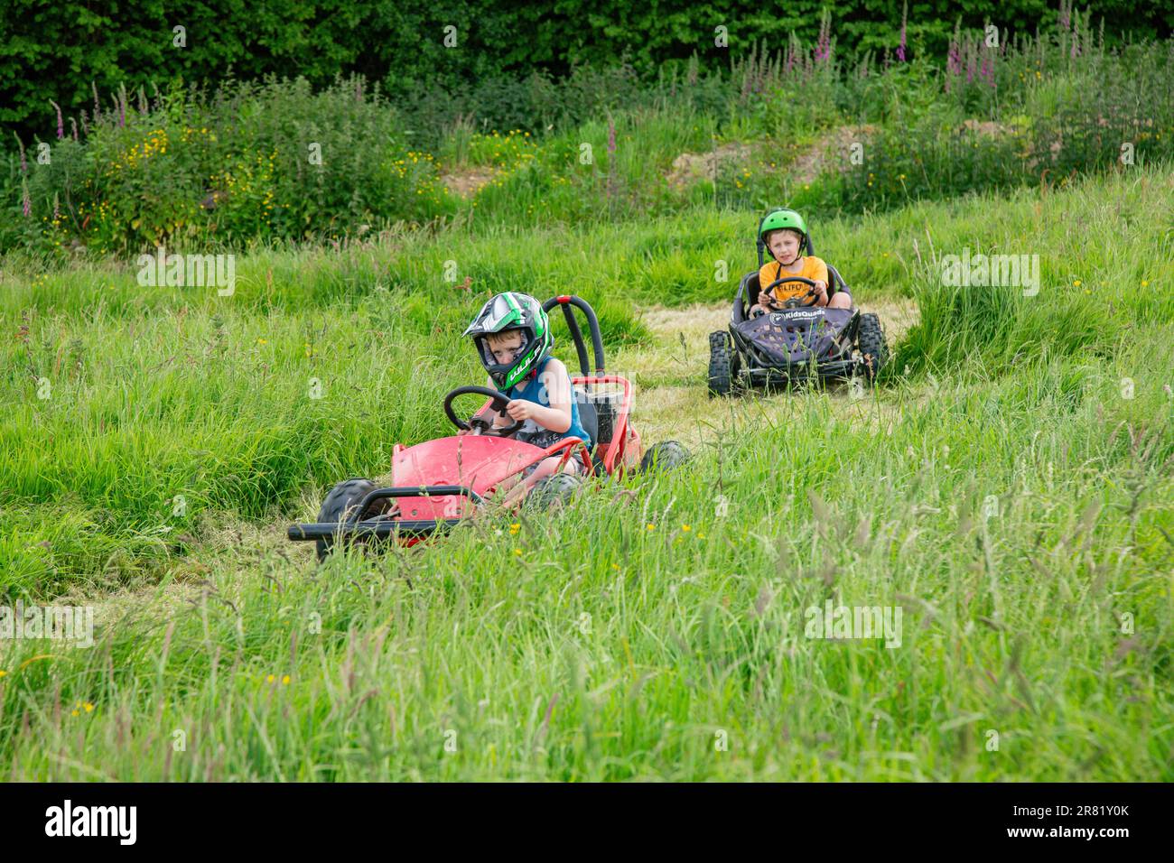 Electric powered Go-Kart racing around a field, High Bickington, North Devon, England, United Kingdom. Stock Photo