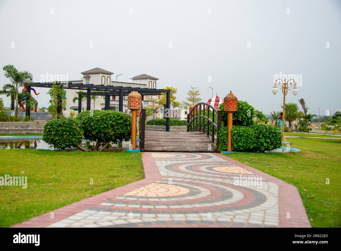 A public park in Kharian City, Pakistan, with a wooden bridge and