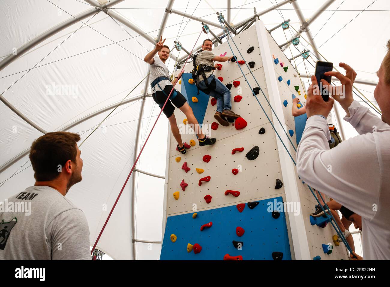 Berlin, Germany. 18th June, 2023. Participants climb an indoor climbing