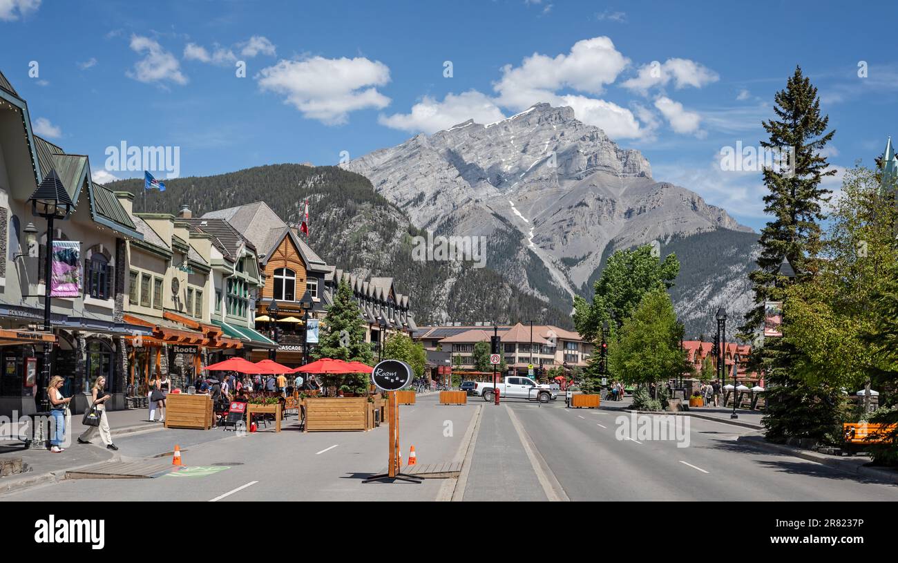 View along Banff Avenue towards snow capped Cascade Mountain in Banff, Alberta, Canada on 4 June 2023 Stock Photo