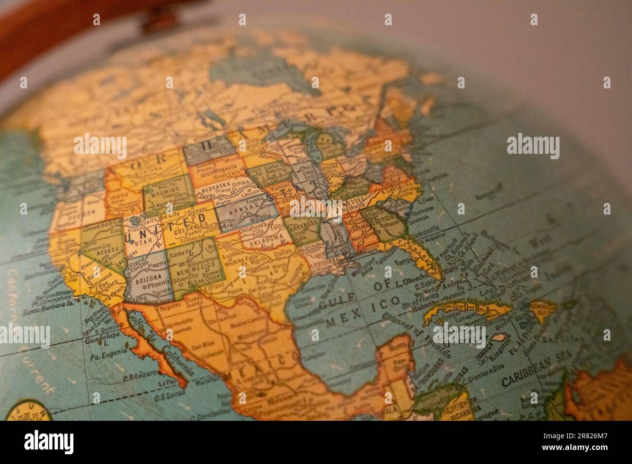 A high-resolution photograph of a detailed, close-up view of a globe, showing the United States in the center Stock Photo