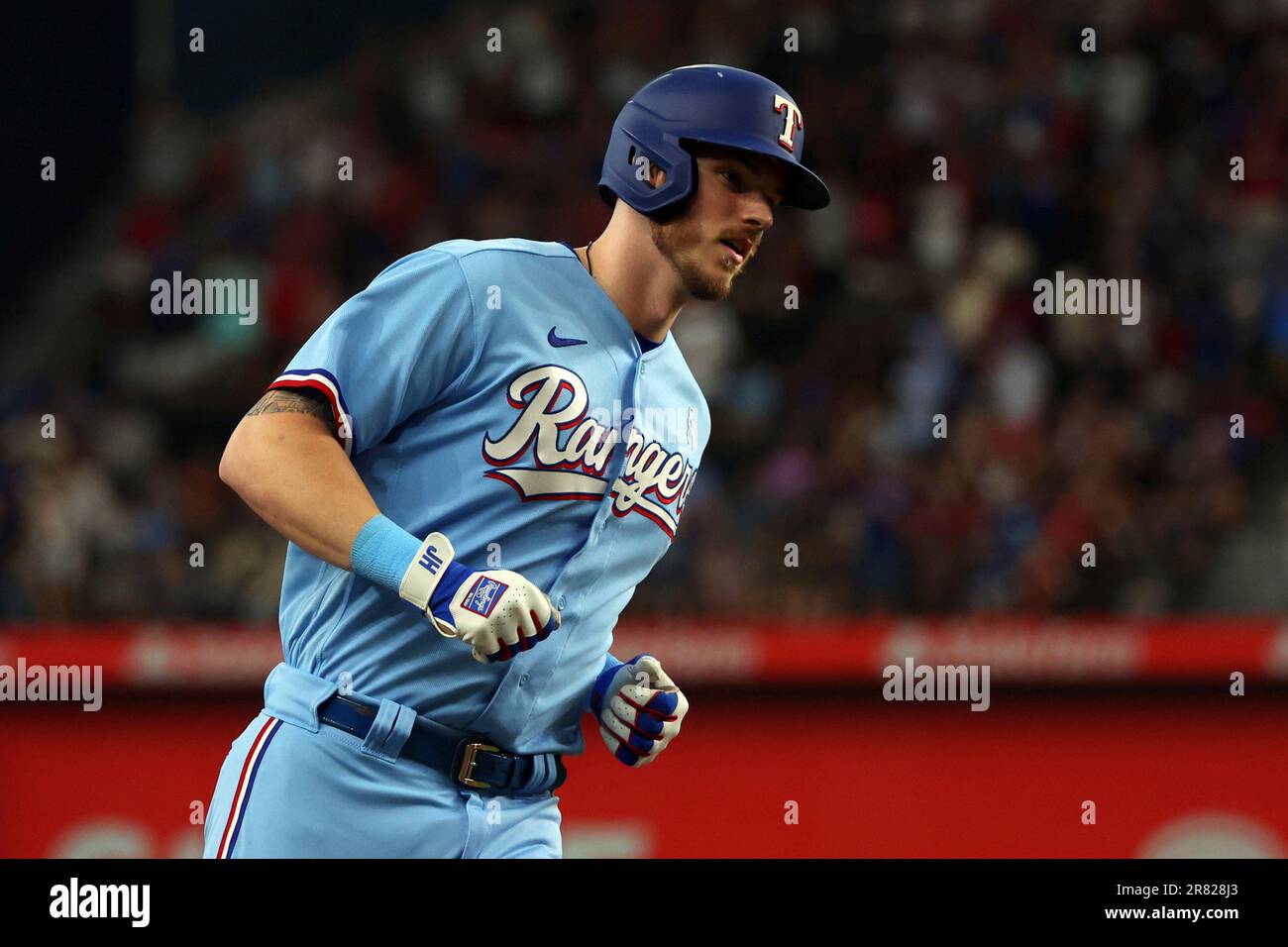 Texas Rangers' Jonah Heim runs the bases after a solo home run in