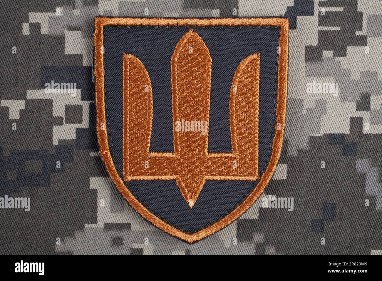 KYIV, UKRAINE - October 5, 2022. Russian invasion in Ukraine 2022. Ukraine Army uniform shoulder sleeve insignia badge on camouflaged uniform backgrou Stock Photo