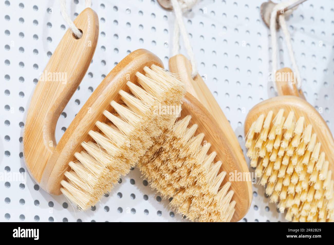 kitchen brushes hang in supermarket Stock Photo