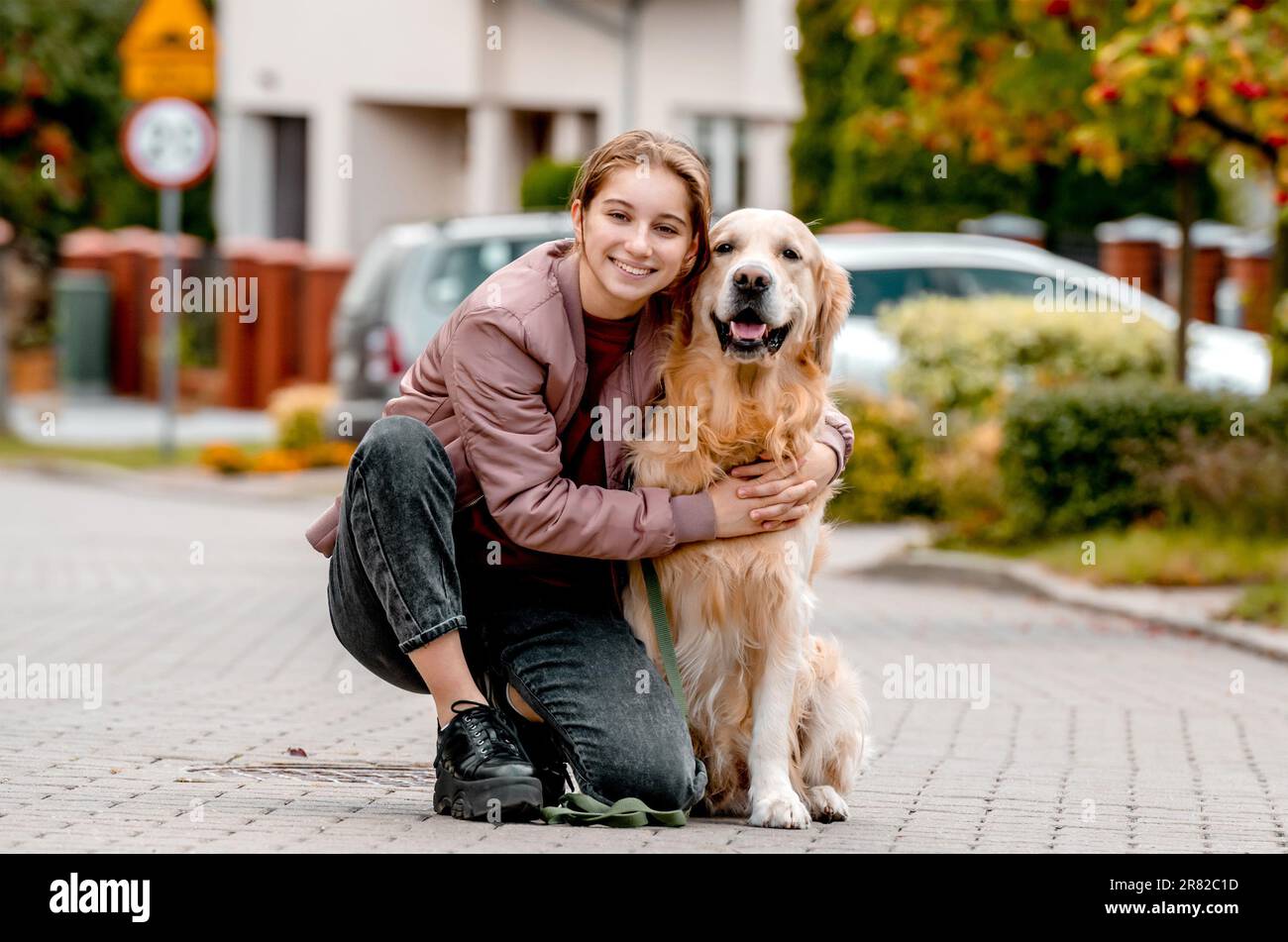 Teen girl walking dog hi-res stock photography and images - Alamy