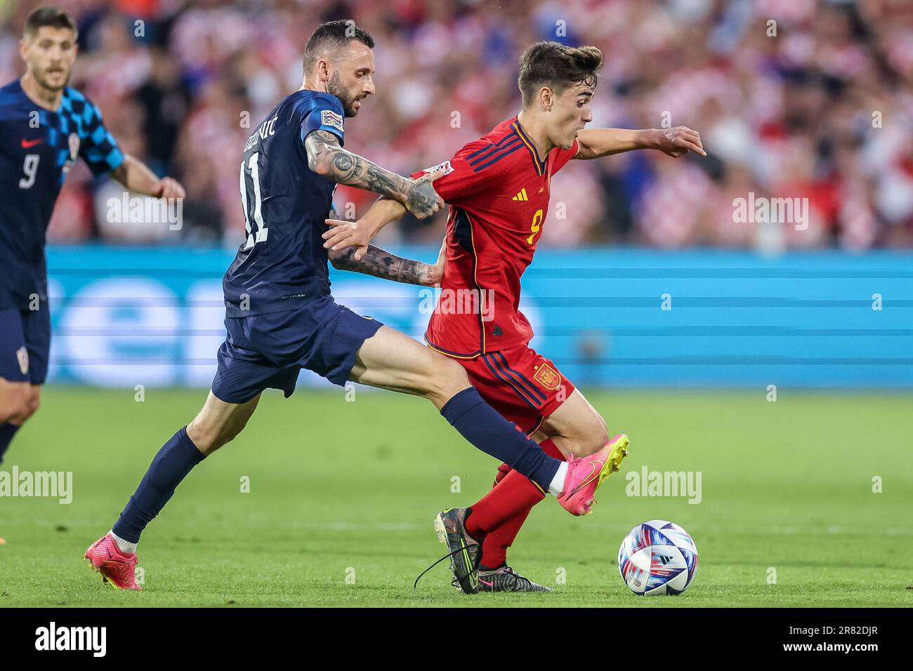 Rotterdam, Netherlands. 18th June, 2023. ROTTERDAM, NETHERLANDS - JUNE 18: Marcelo Brozovic of Croatia battles for the ball with Gavi of Spain during the UEFA Nations League Final match between Croatia and Spain at Stadion Feijenoord de Kuip on June 18, 2023 in Rotterdam, Netherlands (Photo by Henk Jan Dijks/ Orange Pictures) Credit: Orange Pics BV/Alamy Live News Stock Photo