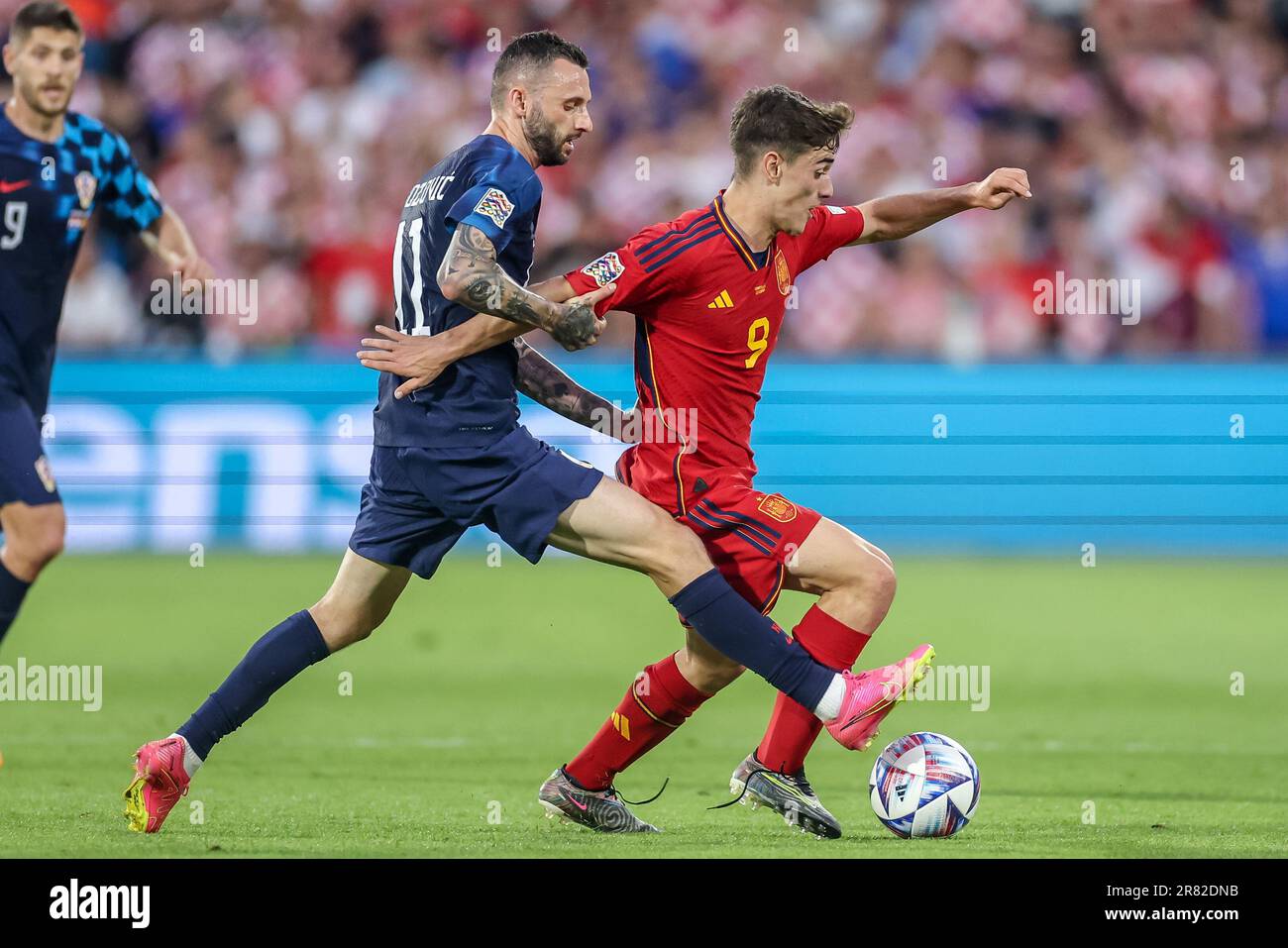 Rotterdam, Netherlands. 18th June, 2023. ROTTERDAM, NETHERLANDS - JUNE 18: Marcelo Brozovic of Croatia battles for the ball with Gavi of Spain during the UEFA Nations League Final match between Croatia and Spain at Stadion Feijenoord de Kuip on June 18, 2023 in Rotterdam, Netherlands (Photo by Henk Jan Dijks/ Orange Pictures) Credit: Orange Pics BV/Alamy Live News Stock Photo