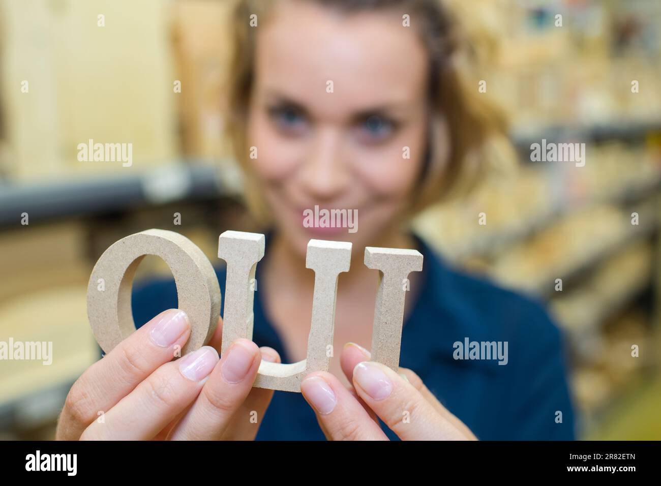 young beautiful girl showing oui gesture Stock Photo - Alamy