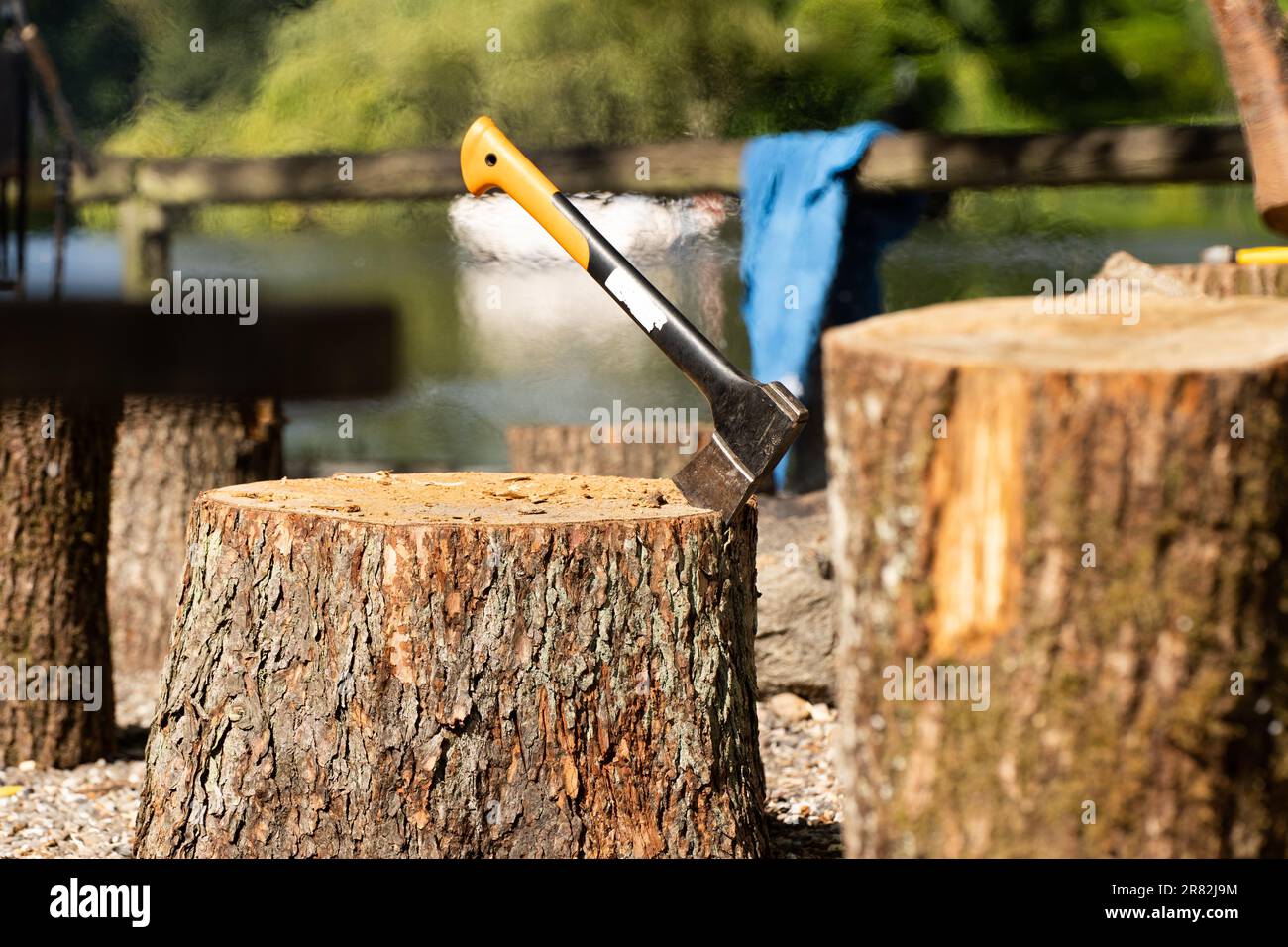 An axe with a wooden handle and a steel head, poised and ready to be used for cutting timber Stock Photo