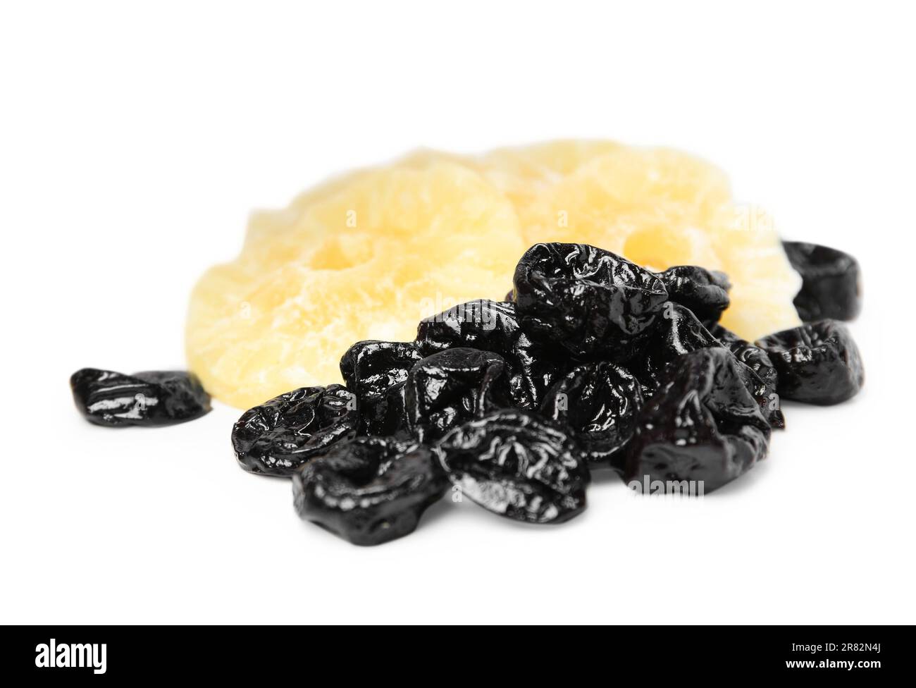 Tasty dried prunes and pineapple on white background Stock Photo - Alamy