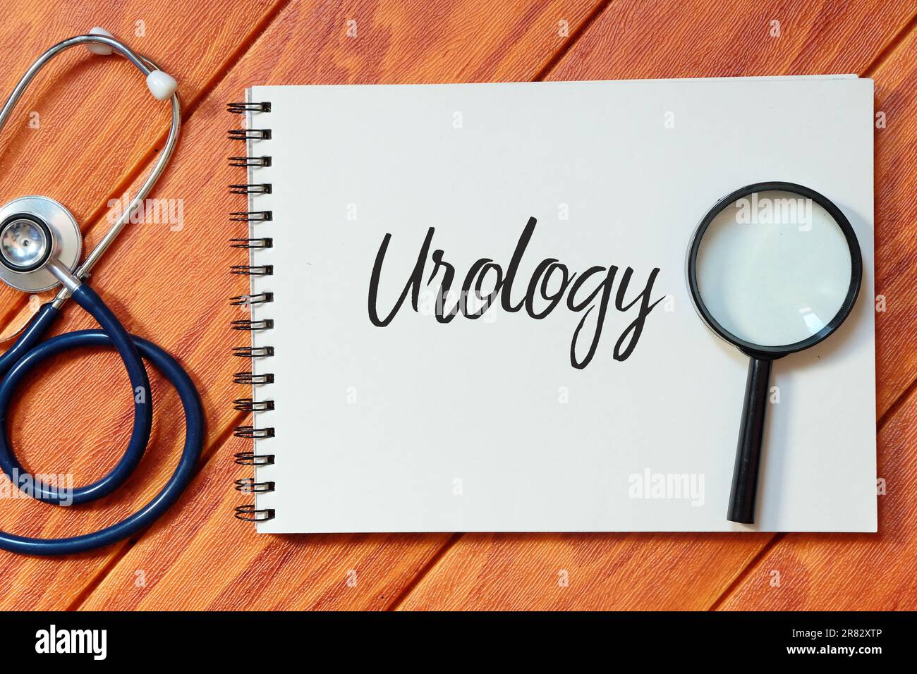 Top view of stethoscope,magnifying glass and notebook written with