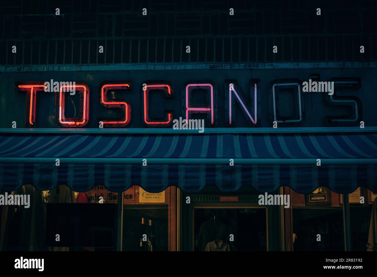 Toscanos Mens Shop vintage neon sign at night, Westerly, Rhode Island Stock Photo