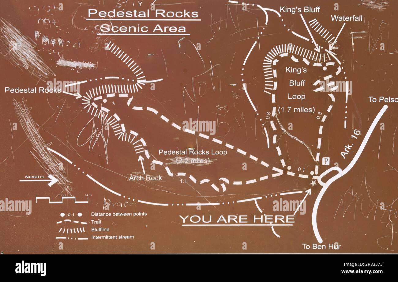 A map, complete with graffiti, on a sign at Pedestal Rocks Scenic Area, showing the Pedestal Rock Trail and the Kings Bluff Trail, Arkansas Stock Photo